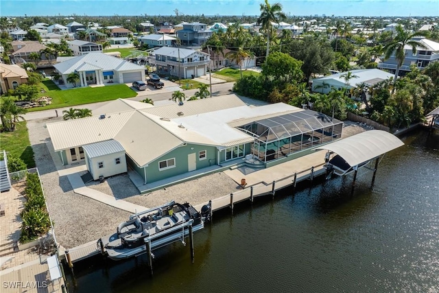 birds eye view of property featuring a residential view and a water view