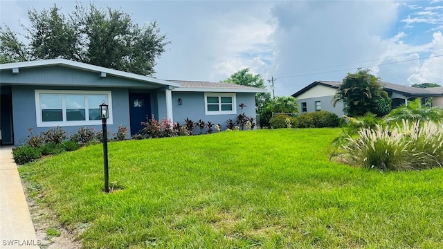 single story home featuring a front yard