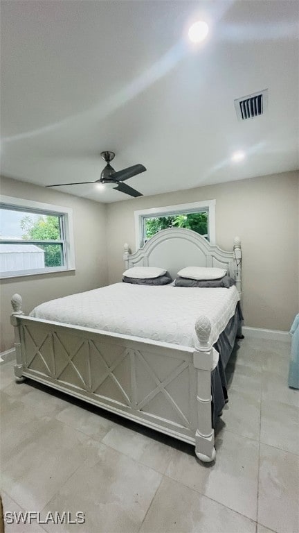 bedroom featuring ceiling fan and light tile patterned flooring