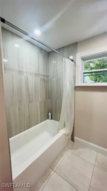 bathroom featuring shower / bath combo and tile patterned floors