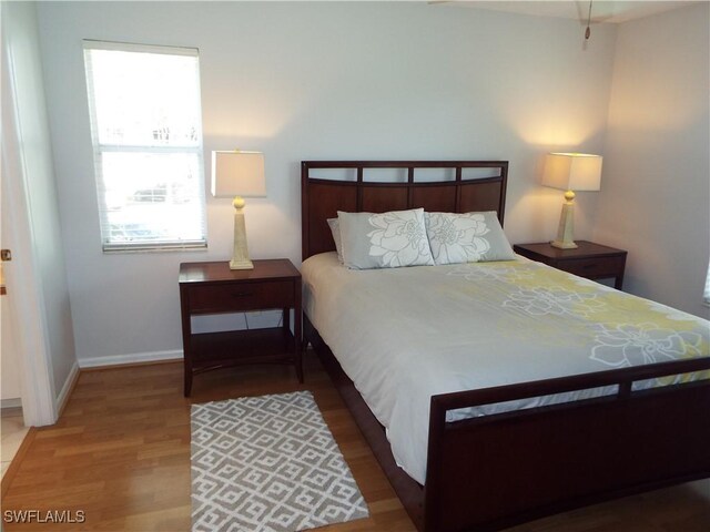 bedroom featuring wood-type flooring