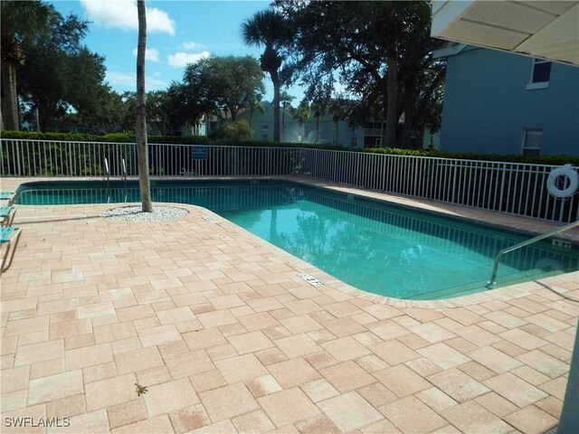 view of swimming pool featuring a patio area