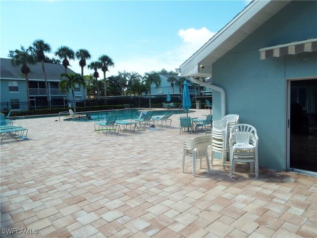 view of swimming pool featuring a patio