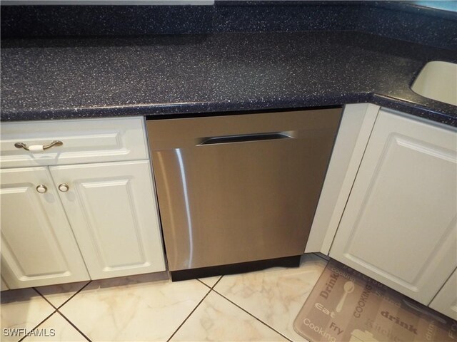 interior details with dishwasher and white cabinets