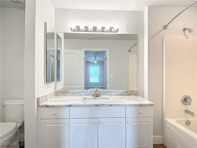 full bathroom with bathing tub / shower combination, vanity, toilet, and ceiling fan