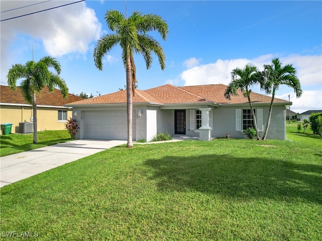 single story home with a garage and a front lawn