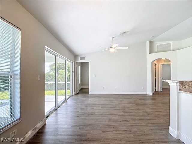 unfurnished room featuring ceiling fan, hardwood / wood-style floors, and vaulted ceiling