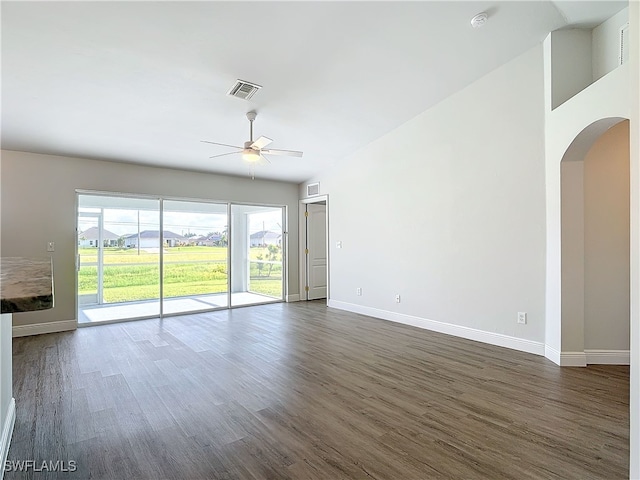 spare room featuring ceiling fan and dark hardwood / wood-style floors