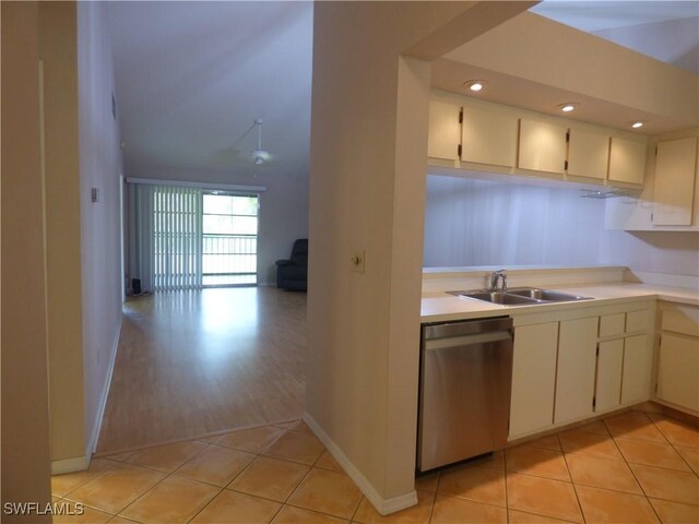 kitchen with sink, light hardwood / wood-style flooring, cream cabinets, and dishwasher