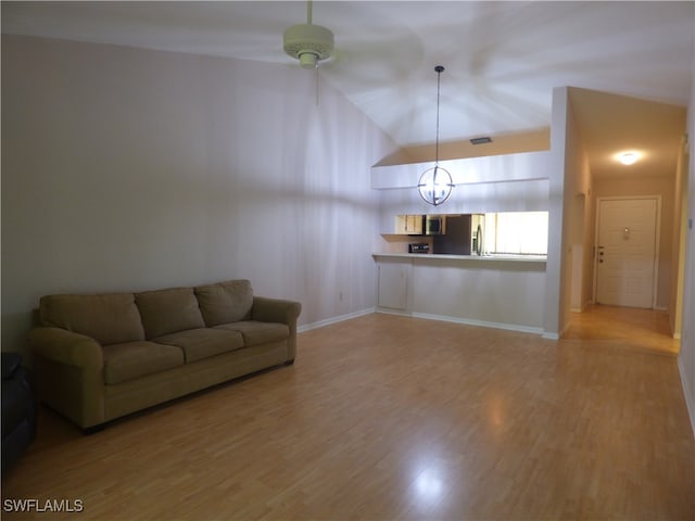 unfurnished living room with light hardwood / wood-style floors and lofted ceiling