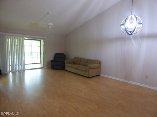 unfurnished room with ceiling fan, lofted ceiling, and hardwood / wood-style floors