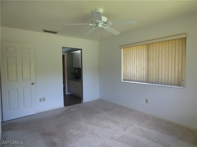 unfurnished bedroom with carpet flooring and ceiling fan