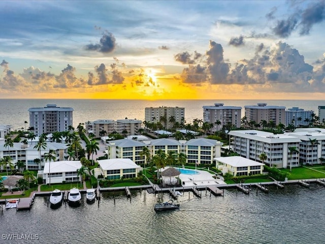 aerial view at dusk with a water view