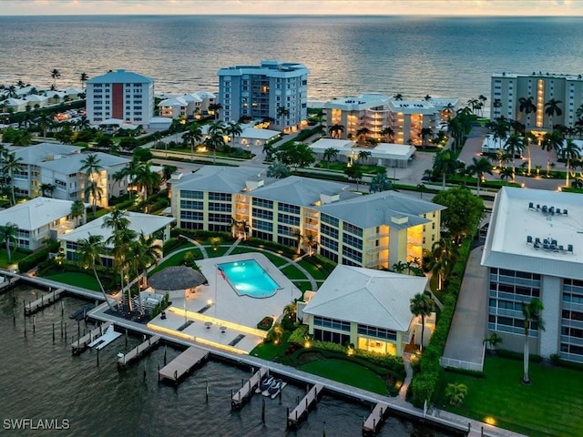 birds eye view of property with a water view