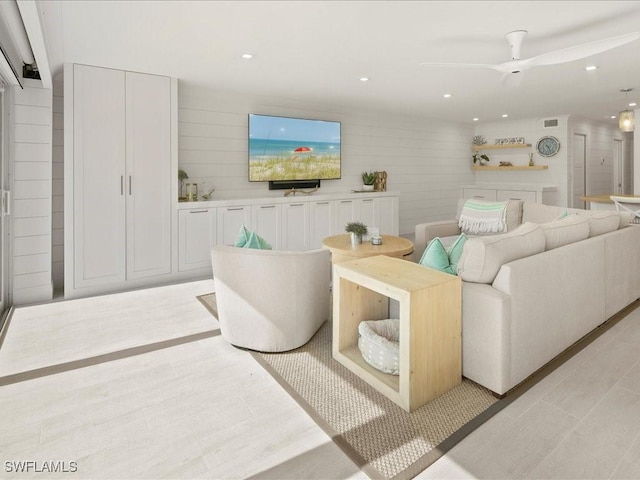 living room featuring ceiling fan