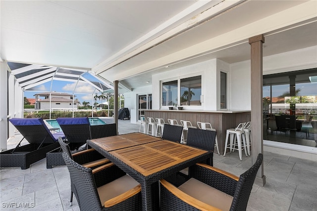 view of patio with a lanai