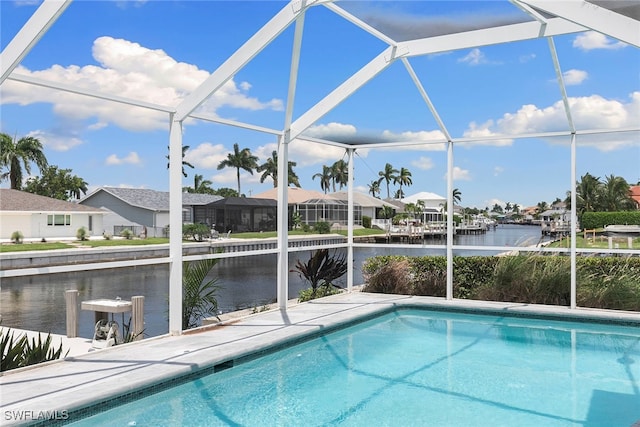 view of pool featuring a dock, a water view, a patio, and a lanai