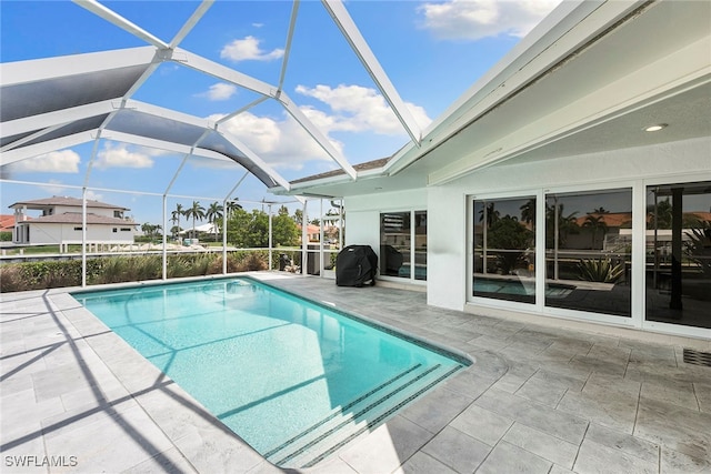 view of pool featuring a patio and a lanai