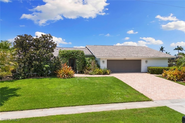 ranch-style house with a front lawn and a garage