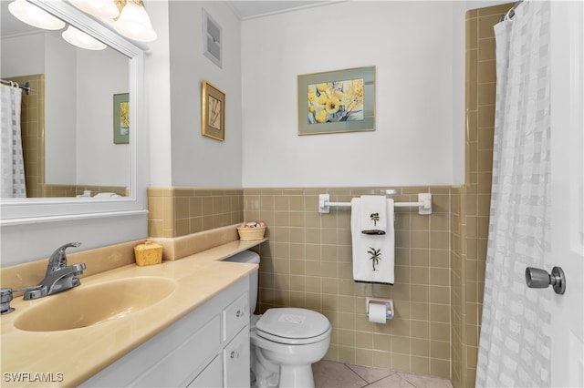 bathroom featuring tile walls, vanity, toilet, tile patterned floors, and a shower with shower curtain