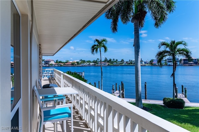 balcony featuring a water view