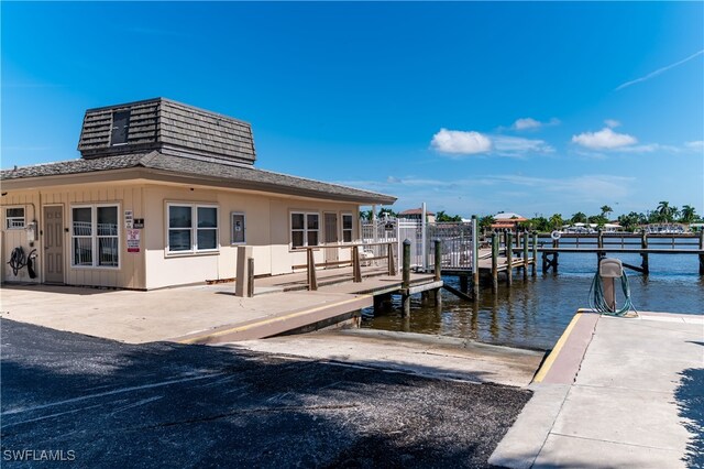 dock area featuring a water view