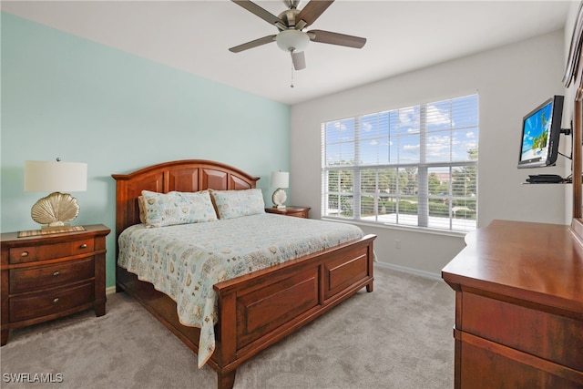 bedroom with light colored carpet and ceiling fan