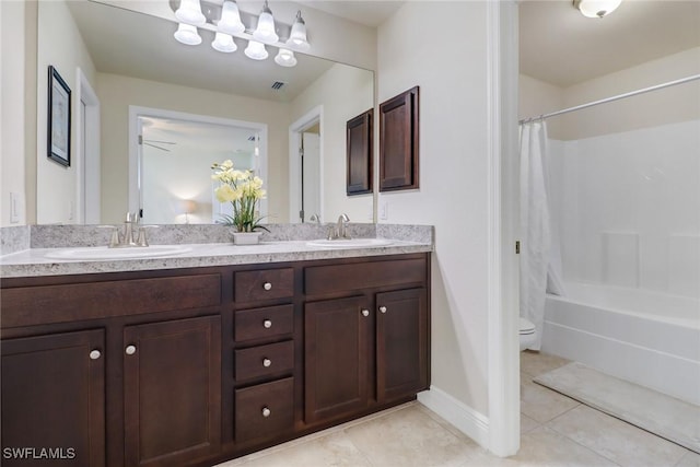 full bathroom with shower / bath combination with curtain, vanity, toilet, and tile patterned flooring