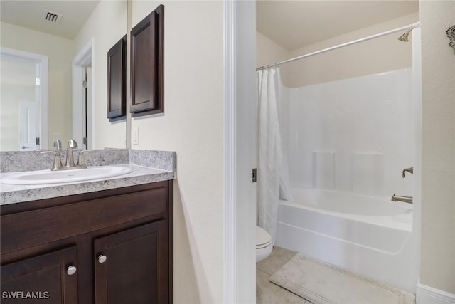 full bathroom with tile patterned flooring, shower / tub combo, vanity, and toilet