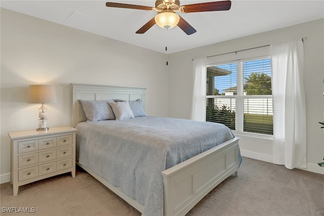 bedroom featuring light carpet and ceiling fan