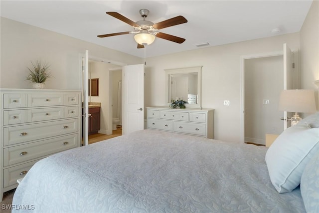 bedroom with connected bathroom and ceiling fan