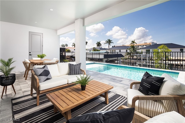 view of pool featuring a patio and an outdoor hangout area