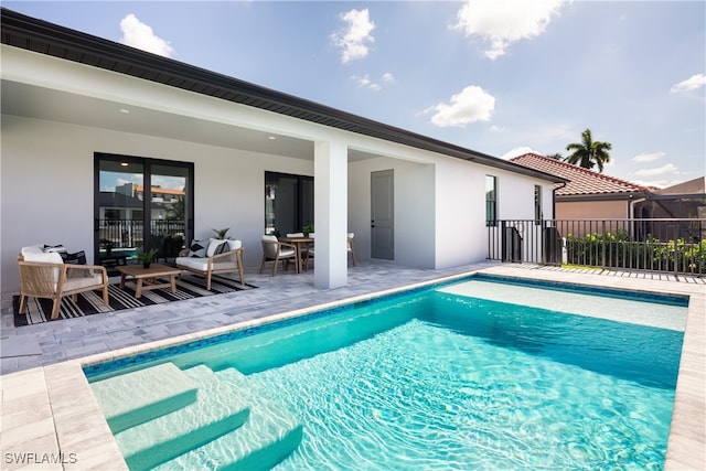 view of swimming pool with a patio area