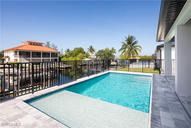 view of pool with a water view