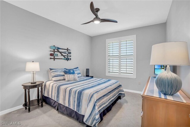 bedroom featuring light tile patterned flooring and ceiling fan