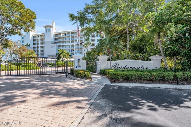 exterior space featuring a gated entry and curbs