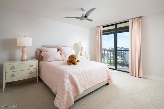 bedroom featuring ceiling fan, expansive windows, access to exterior, and light colored carpet