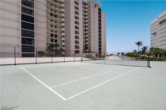 view of sport court with fence