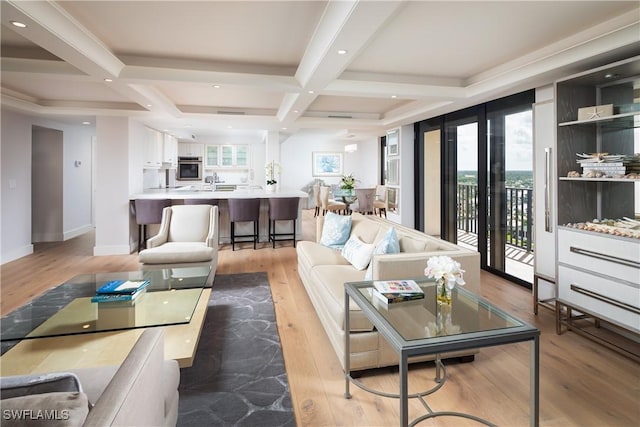 living room with recessed lighting, coffered ceiling, baseboards, light wood-type flooring, and beamed ceiling