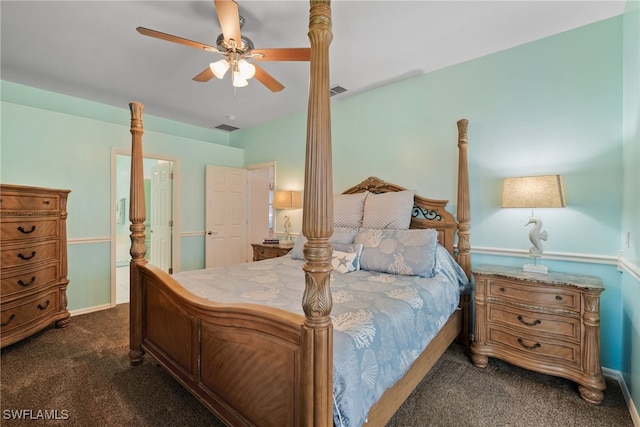 bedroom with dark colored carpet, visible vents, ceiling fan, and baseboards