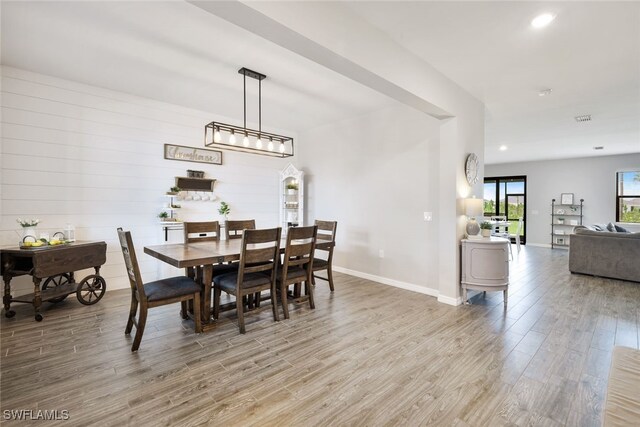 dining area featuring wood-type flooring