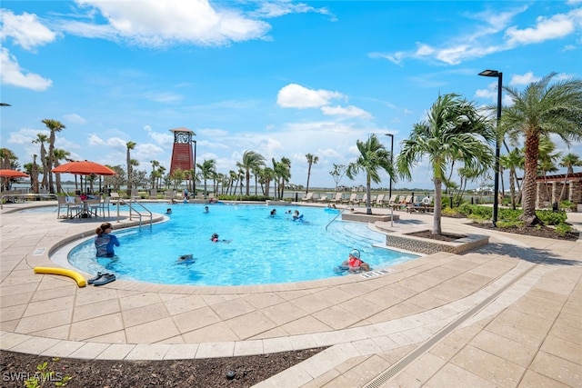 pool with a patio area