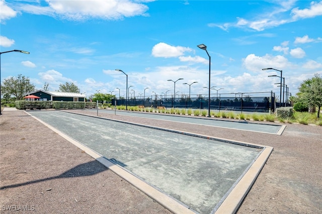 view of home's community with fence