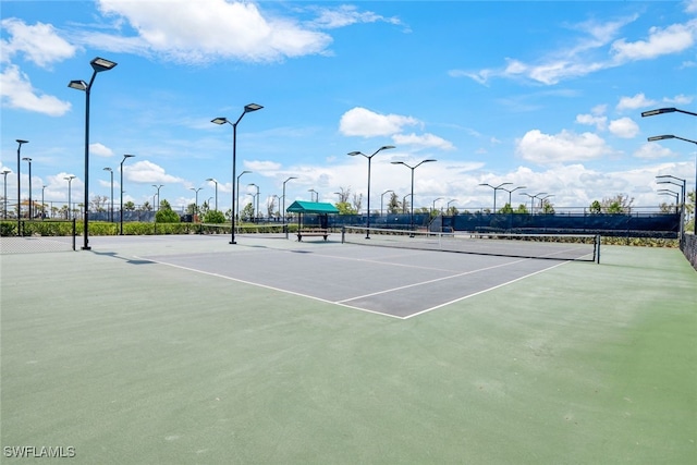 view of sport court with fence