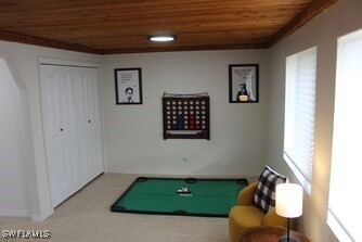 game room with baseboards, billiards, and wood ceiling