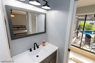 bathroom with ceiling fan and vanity