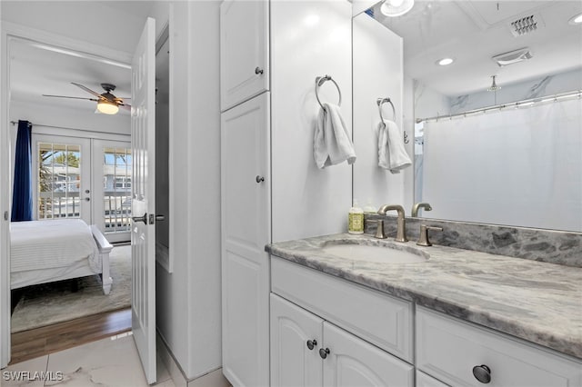 bathroom featuring vanity, french doors, ceiling fan, and a shower with shower curtain