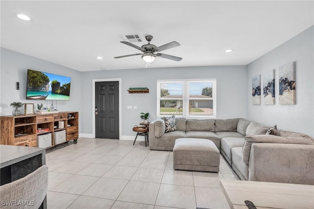 living room with ceiling fan and light tile patterned floors