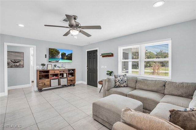 tiled living room with ceiling fan