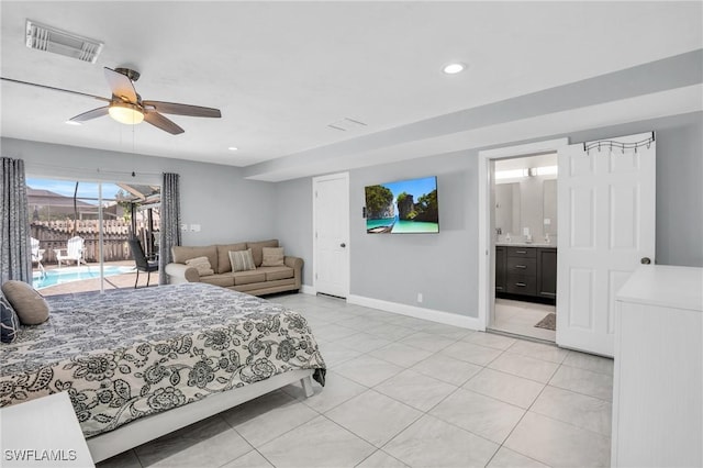 tiled bedroom with ceiling fan, ensuite bath, and access to exterior